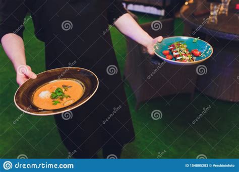 Waitress Is Carrying Two Plates With Meat Dish Stock Image Image Of