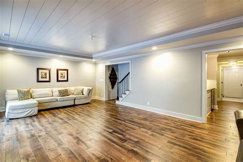 Laminate flooring thermally fused laminate laminate flooring cabinetry countertops shelving woodgrain ceiling and wall planks make your selection from this brochure. Traditional Basement with Crown molding, High ceiling ...