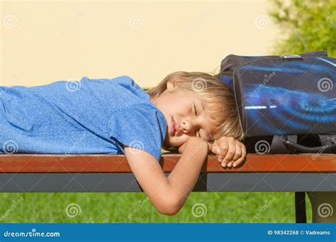 Tired Boy Relaxing After School Boy Lying With Closed Eyes On The
