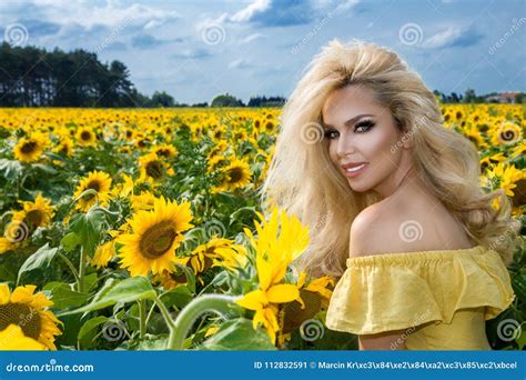 Beautiful Blonde Woman Standing On A Meadow With Sunflowers Stock Image Image Of Skin Makeup