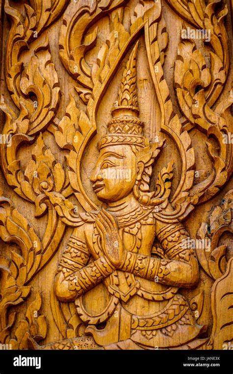 Traditional Thai Art In Wood Carving For Decoration On Buddhist Temple Doors Or Windows Stock