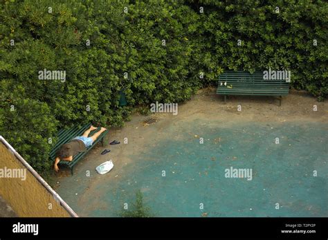 Homeless Man Sleeping In A Park Stock Photo Alamy