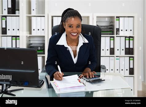 African Professional Accountant Woman With Calculator Doing Accounting