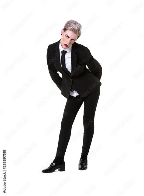 Short Haired Blonde Model In A Suit Shirt And Tie Leaning Forward