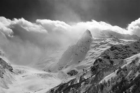 Glacier Snowy Mountain Peaks And Sunlight Cloudy Sky Stock Image