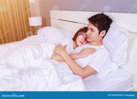 Happy Young Attractive Couple Hugging On Bed In Bedroom Stock Image Image Of Lifestyle Love