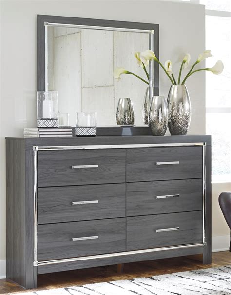 Modern design with chrome handles and accents designed. Signature Design by Ashley Lodana Glam 6 Drawer Dresser ...