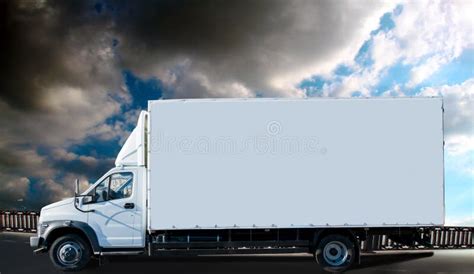 Truck Are Parked In A Parking Lot Next To A Logistics Warehouse By The