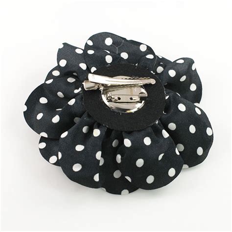 white polka dot on black fabric flower pin