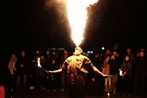 hd wallpaper man spitting fire photography performing front crowd people wallpaper flare