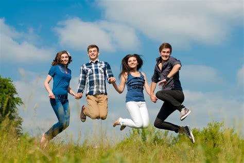 Happy Jump Group Of Young People Outdoors Stock Image Image Of Human