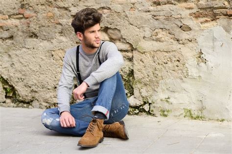 Attractive Guy Sitting On The Ground Photo Free Download