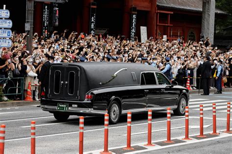 Shinzo Abes Funeral Procession Passes Through A Somber Tokyo The