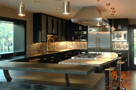 Kitchen cabinets #1 in nwi and chicago area with over 5,000+ satisfied customers, micka cabinets is the most complete and trusted kitchen & bath company. Gourmet Kitchen: Black cabinet with Black Countertop - Industrial - Kitchen - Chicago - by In ...