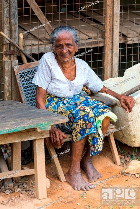 Old Grandma Poor But Proud Sitting In Front Of Their Hut Directly At The Road To Mirissa