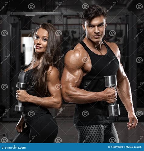 Sporty Sexy Couple Showing Muscle And Workout In Gym Muscular Man And