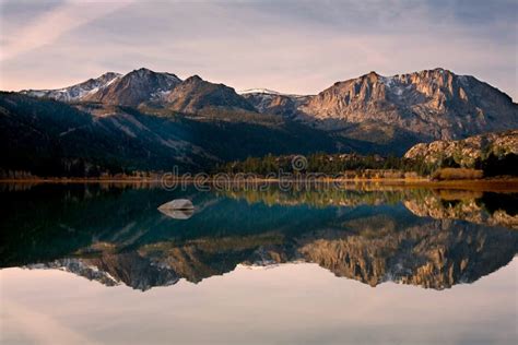 Scenic View Of A Mountain And Lake With Reflection Stock Image Image