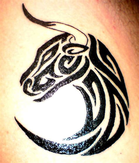 Grey ink taurus head and black tribal taurus tattoo on shoulder. Taurus tribal tattoo | Tattoos | Pinterest | Taurus ...
