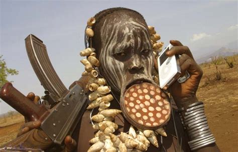 Mursi Tribeswoman With Ipod And Ak Wired