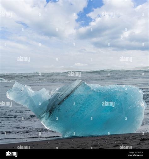 Iceberg Over The Black Sand Beach Jokulsarlon Stock Photo Alamy