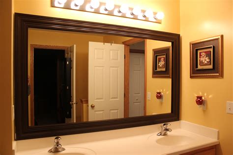 Make a diy mirror frame using the arrow t50acd compact electric staple gun and the arrow pt23g pneumatic pin nailer. Crown molding frame around plain boring mirror. White ...