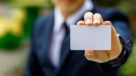 young businessman hand holding blank white credit card