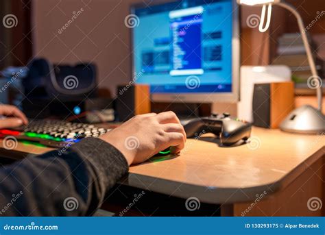 Young Teenage Boy Playing Video Games On Personal Computer Stock Image
