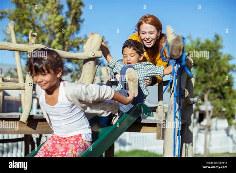 Teacher And Students Playing On Playground Stock Photo Alamy