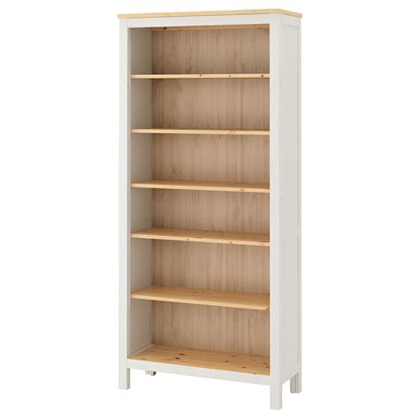 A White Bookcase With Wooden Shelves On Each Side