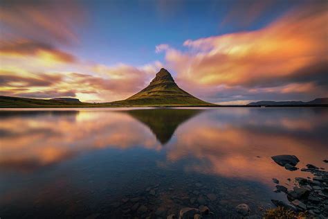 Sunset Over Kirkjufell Mountain With Reflection In A Nearby Lake In