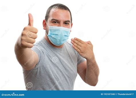 Male Presenting Disposable Mask Making Thumb Up Like Gesture Stock