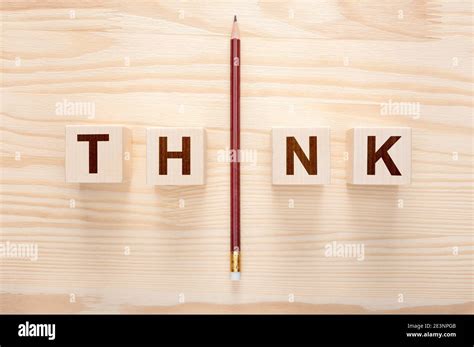 Think Concept Word Think On Wooden Background One Pencil With Word