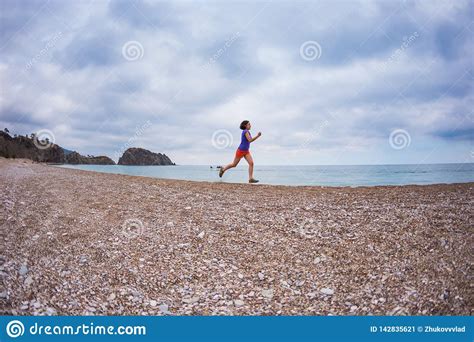 the girl runs along the sandy beach stock image image of recreation motion 142835621