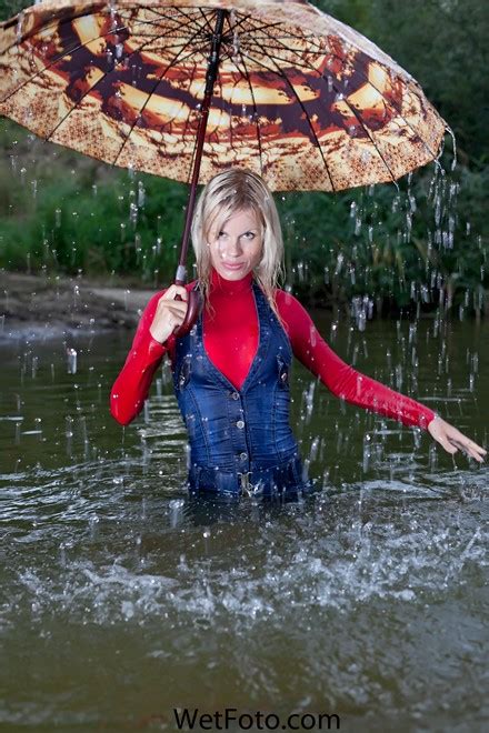 wetlook by sweet girl in denim jumpsuit sweater socks and shoes on lake wetlook one