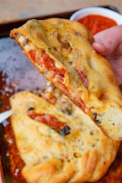 Easy Calzone Pizzas Filled With Pepperoni Sausage Olives Onions And