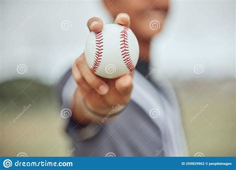 Athlete With Baseball In Hand Man Holding Ball On Outdoor Sports Field