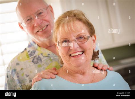 Happy Caucasian Senior Couple Portrait Inside Kitchen Stock Photo Alamy