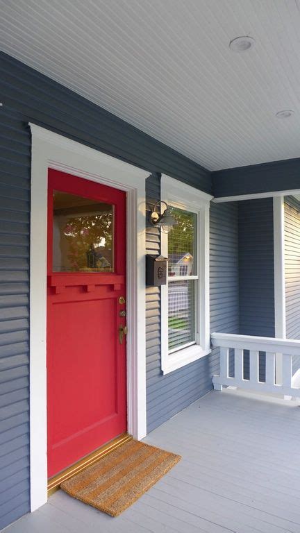 The Blue Siding Of This Home Contrasts Beautifully With The Red Door