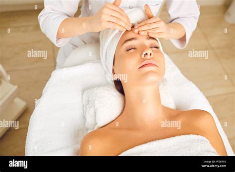 Face Woman Massage Relax Close Up Facial Massage To A Beautiful Girl Lying In A Beauty Clinic