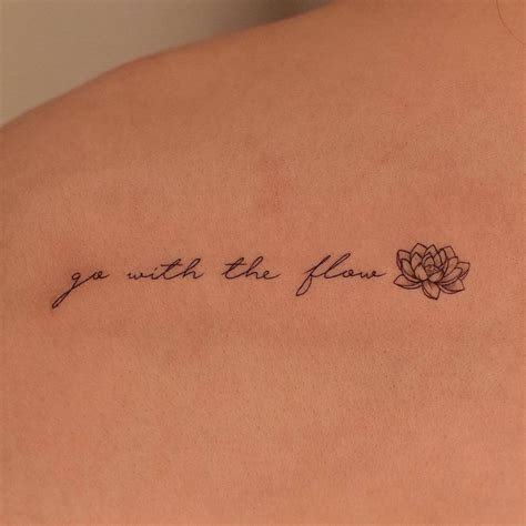 Go With The Flow Lettering Tattoo On The Shoulder