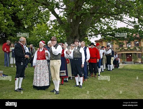 people in traditional swedish folk costumes at midsummer celebration naas castle estate sweden