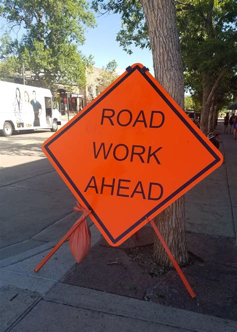 This Road Work Ahead Sign Is In Arial Font And Not The Standard Road