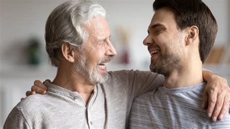 happy mature dad hug show love to adult son stock image image of offspring home 176490115