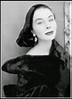 Bettina Graziani in hat of black velvet and raw silk and wearing ...
