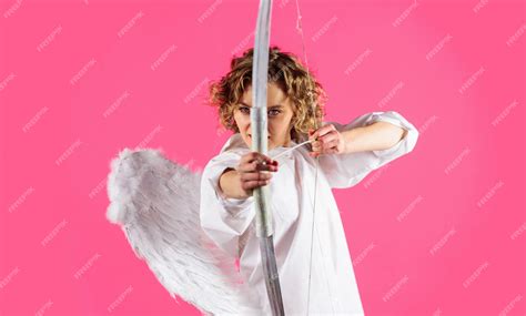 Premium Photo Valentines Day Angel Cupid Girl With Bow And Arrow Curly Woman In White Wings