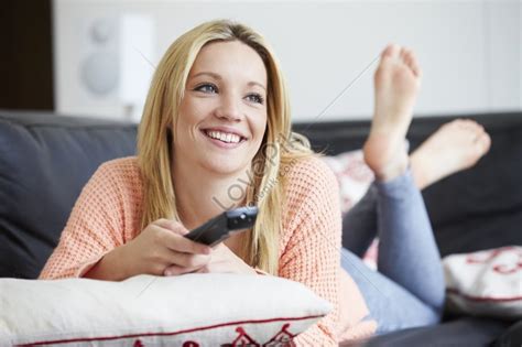 a teenage girl relaxing at home while watching television picture and hd photos free download