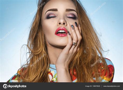 Sexy Girl With Closed Her Eyes And Opened Mouth Keeps Hand On Face