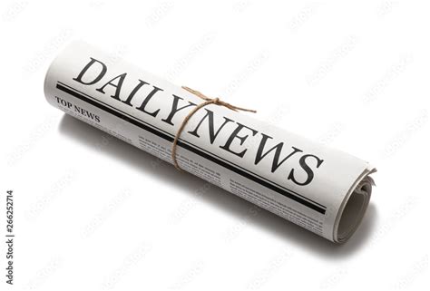 Rolled Business Newspaper With The Headline News Isolated On White