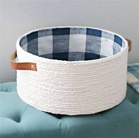 This rope basket is screaming to hold a throw (or 4), don't you think? IHeart Organizing: DIY Lined Rope Basket with Handles