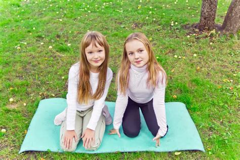 Two Girls Sitting On Grass Stock Image Image Of Summer 57432719